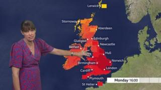 Susan Powell standing in front of a UK weather map