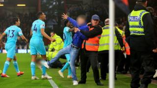 Bournemouth v Newcastle pitch incursion: Five fans charged - BBC News