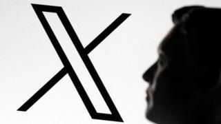 A 3D-printed miniature model of Elon Musk and the X logo are seen in this illustrative photo.