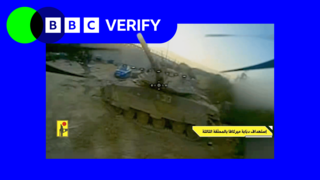 A screenshot from a video feed of an FPV drone, it is approaching a tank 