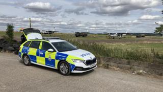 A police car parked near an airfield in Nottinghamshire
