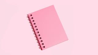 Pink Note Pad On Pink Background - stock photo