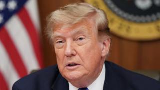 US President Donald Trump speaks during a Cabinet meeting at Camp David.