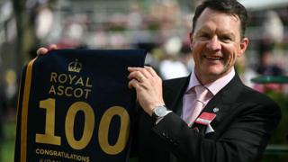Trainer Aidan O'Brien poses after training his 100th winning horse