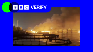 an image of a harbour on fire at night in the port city in Iran. the photo is surrounded by BBC Verify blue and green branding