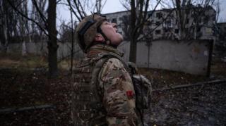 A Ukrainian serviceman checks the sky for fpv-drones in the frontline town of Kostyantynivka, Donetsk region, amid the Russian invasion of Ukraine. taken in 2025