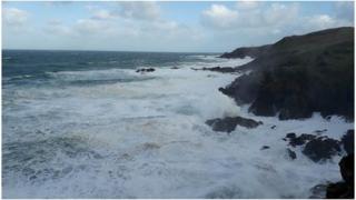 Waves crashing on rocks