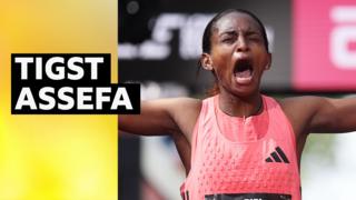 Tigst Assefa celebrates London Marathon win with eyes closed, mouth open and arms outstretched