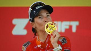 Kimberley Le Court kisses her winner's medal
