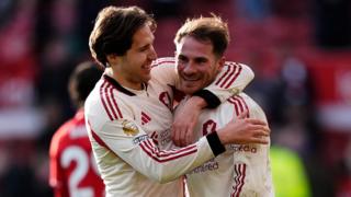 Chiesa and Mac Allister celebrate