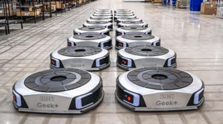 Geek+ floor robots lines up in a UK warehouse