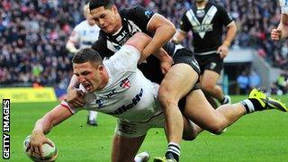 England's Sam Burgess (L) scores a try during the 2013 Rugby League World Cup semi-final match between England and New Zealand at Wembley Stadium in London on November 23, 2013.