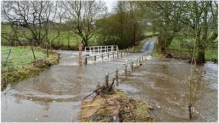 Flooded country lanes surrounded by fields
