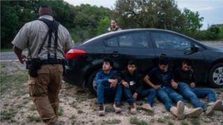 A Texas sheriff arresting suspected migrants in March 2023