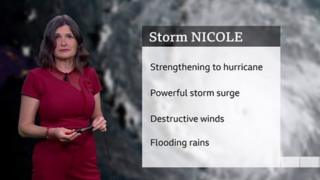 Helen Willetts stands in front of a screen with details of weather impacts of Storm Nicole