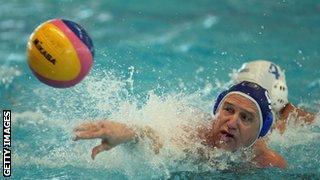 Older man plays water polo