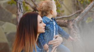 mum holding daughter