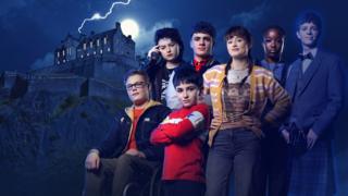 Gifted students standing together in front of a dark night sky