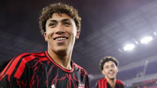 Julian Hall smiles after scoring a hat-trick for Red Bull New York
