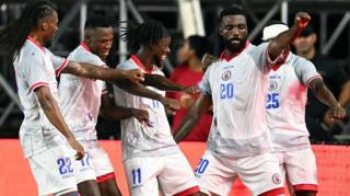 Haiti's forward #20 Frantzdy Pierrot celebrates with teammates after scoring his team's third goal during an international friendly football match between Haiti and New Zealand at Inter Miami CF Stadium in Fort Lauderdale, Florida on June 2, 2026.