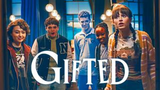 Gifted students peering cautiously through a doorway - the Gifted logo is written in white at the centre bottom