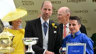 Prince William presents jockey William Buick with his award for riding Ombudsman to victory in the Prince Of Wales's Stakes on the second day of Royal Ascot in 2026