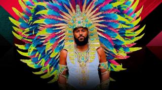 A man in a colourful costume.
