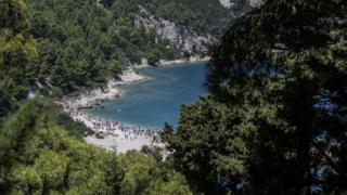 Visitors at the beach on Sazan island, Albania