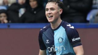 Luke Harris in action for Wycombe Wanderers in a League One match last season