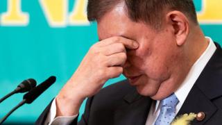 Japan's ruling party set to lose majority, exit polls suggest