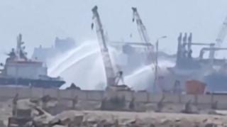 Social media video shows tugboats firing water jets at vessels on fire in Damietta port, Egypt (29 July 2026)