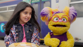 Elsee from I Spy, You Spy sat with a young girl.