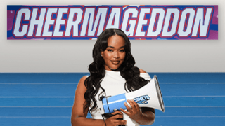 A woman holding a microphone in a cheerleading gym