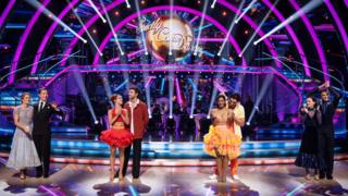 The four Strictly Come Dancing semi-finalists, in dancing costumes, waving and clapping on the dancefloor