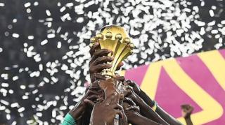 Senegal's players hold the trophy after winning the Africa Cup of Nations 2021 final.
