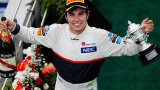 Sergio Perez of Mexico and Sauber F1 celebrates on the podium after finishing second during the Malaysian Formula One Grand Prix at the Sepang Circuit