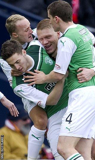 Grifiths and O'Connor help celebrate the latter's opening goal at Hampden