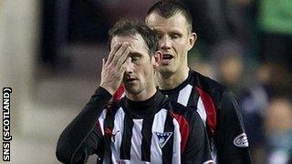 Dunfermline players look dejected after their relegation from the SPL is confirmed