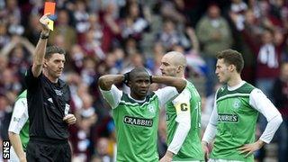 Hibernian's Pa Kujabi is sent off by referee Craig Thomson