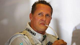 Michael Schumacher looks on in Hungary