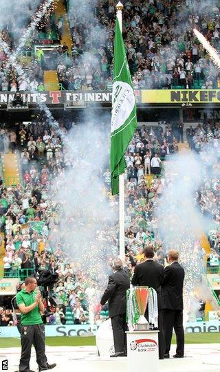 Celtic unfurl the Scottish Premier League championship flag