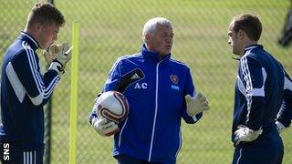 Jack Hamilton, goalkeeping coach Allan Carswell and Jamie MacDonald chat during training