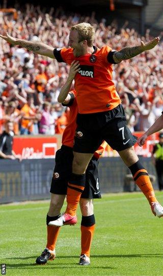 Russell celebrates as he scores against Dundee before being sent off