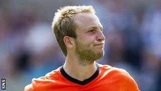 Two-goal Johnny Russell celebrates against Dundee before being sent off