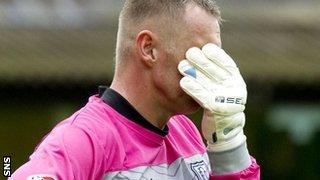 Dundee goalkeeper Rab Douglas shows his disappointment at Tannadice