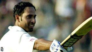 Indian batsman Vangipuram Venkatsai Laxman acknowledges the cheers of the crowd, on scoring his maiden century, during Indias second innings on the third day of the second test match against Australia, in Calcutta Tuesday March 13, 2001.