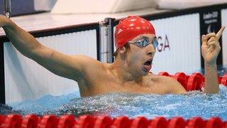 Jonathan Fox celebrates breaking the men's S7 100m backstroke world record