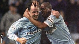 Accrington Stanley manager Paul Cook (l) celebrates with Dion Dublin after scoring a goal for Coventry City