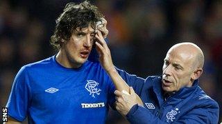 Rangers forward Francisco Sandaza receives treatment on an injury