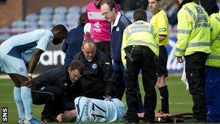 Steven MacLean receives treatment on an injury